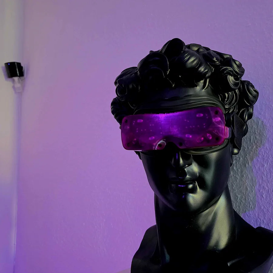 A purple Beyond 2 worn by a black bust of Michelangelo's David against a violet wall