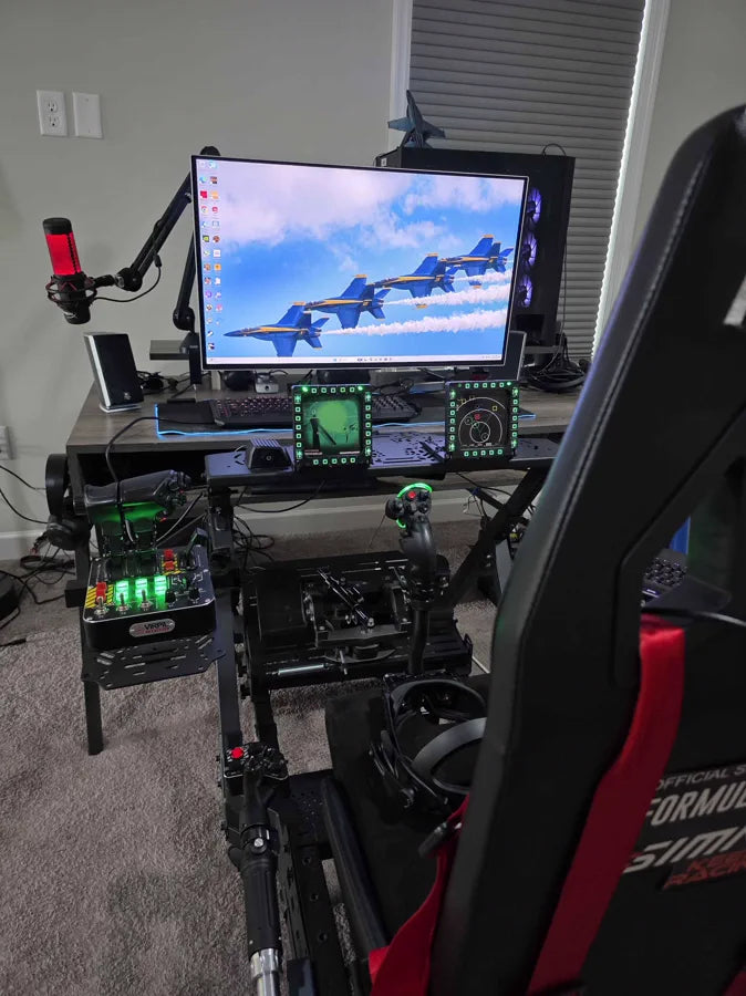 A Beyond 2 on a sim rig desk in front of a flight simulator running on the monitor
